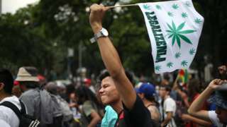 A marijuana legalization activist gestures as he participates in a protest in Mexico City