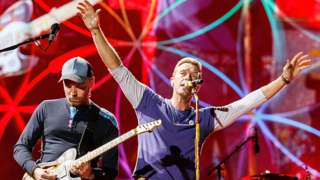 Coldplay's Jonny Buckland and Chris Martin performing in Vancouver in 2017