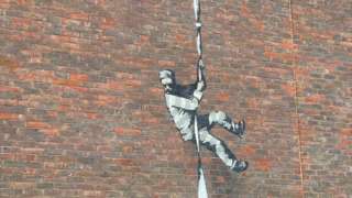 Banksy artwork on wall of Reading Prison