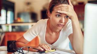 Woman checking bills