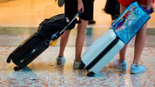 Holidaymakers with baggage