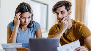 Couple looking at bank statements