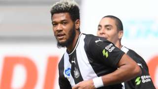 Newcastle striker Joelinton (left)