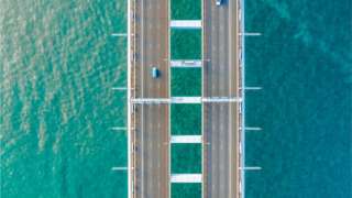 Aerial view of a bridge over sea