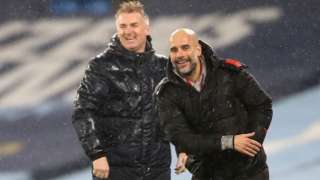 Rival managers Dean Smith and Pep Guardiola share a joke during the reverse fixture