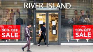 Sales signs outside a closed River Island