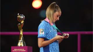 England's Ella Toone walks past the trophy after collecting her runners up medal