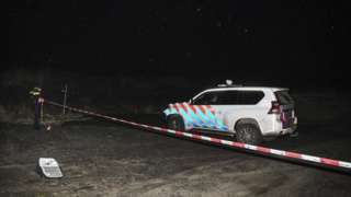 A Dutch police vehicle at the crime scene on Monday