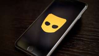 Grindr logo on phone
