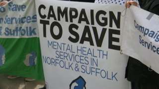 Campaigner's poster called for action over mental health services