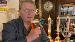 Mark Lee with a pint at the pub