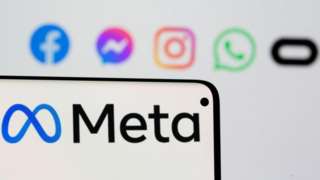 Facebook's new rebrand logo Meta is seen on smartpone in front of displayed logo of Facebook, Messenger, Intagram, Whatsapp and Oculus in this illustration picture taken October 28, 2021