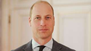 The Prince of Wales wearing a suit and tie