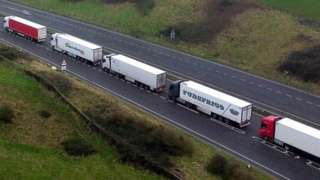 Lorries queue on the A20 at Capel-le-Ferne for the Port of Dover in Kent, on 11 January 2022