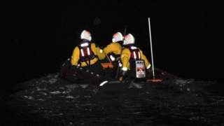 Lifeboat crew in the dark