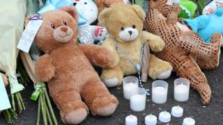 Toys and flowers left at the scene of the incident in 2021