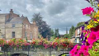 Pink flowers on a bridge in Ashbourne
