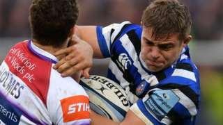 Tom Ellis of Bath holds off Jonah Holmes of Leicester