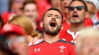 Welsh fans singing at a rugby match