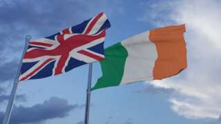 A union flag and an Irish flag