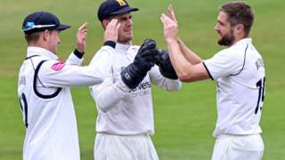 Warwickshire's Chris Woakes celebrated taking the wicket of England team-mate Dawid Malan at Headingley