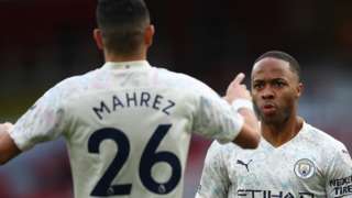 Raheem Sterling and Riyad Mahrez celebrate Manchester City's opener at Arsenal