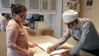 The Dharni family making PPE