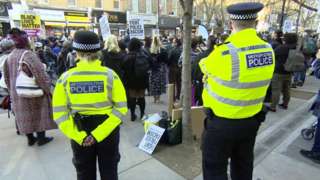 Police officers oversee protest