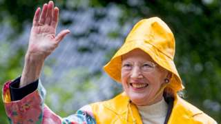 Danish queen wearing yellow hat
