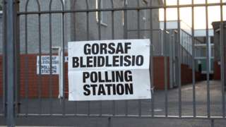 Polling station with bilingual sign
