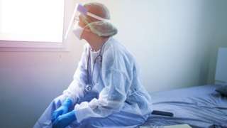 A doctor wearing PPE