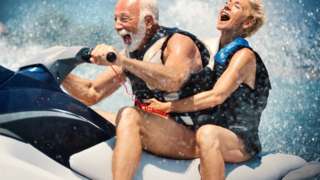 Older man with slightly younger woman on a jet ski
