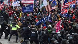 Donald Trump supporters clash with police and security forces as they push barricades to storm the US Capitol in Washington DC. Photo: 6 January 2021