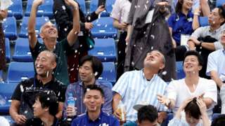 Spectators enjoying the summer snow