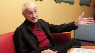 Claude Lorius talks in a Paris hotel in 2011