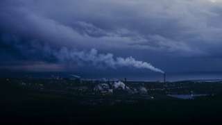 A wide shot of Tata Steel in Port Talbot under a blue and moody sky