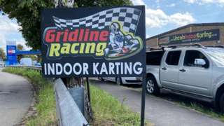 Gridline racing sign