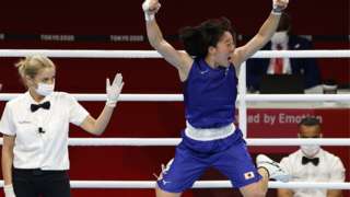 Sena Irie of Japan reacts after winning against Nesthy Petecio of Philippines, unseen, during the Women's Feather Final Bout Boxing events of the Tokyo 2020 Olympic Games at the Ryogoku Kokugikan Arena in Tokyo, Japan, 03 August 2021.