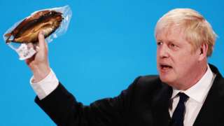 Picture of Boris Johnson holding a kipper at the Conservative leadership hustings