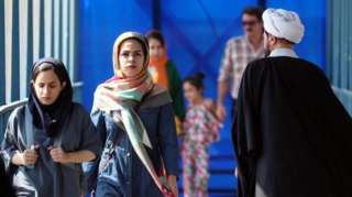 Two veiled Iranian women pictured in Tehran