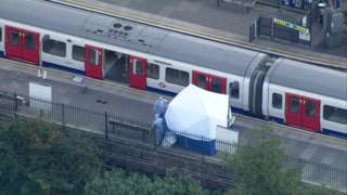 Tube train with forensic officers