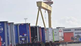 Lorries lined up in front of H&W crane
