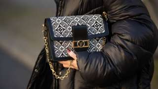 Sonia Lyson is seen wearing bag and shoes Louis Vuitton 1854 collection, Blomst down feather jacket on December 18, 2020 in Berlin, Germany.