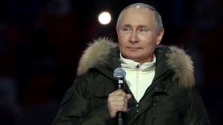 Vladimir Putin en un concierto para conmemorar el séptimo aniversario de la anexión de Crimea por parte de Rusia.