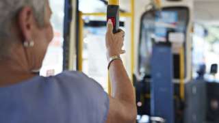 Woman presses bell on bus