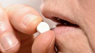 A person taking a Diazepam pill