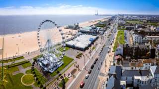 Great Yarmouth seafront. You can see a Ferris wheel, the beach and surrounding buildings