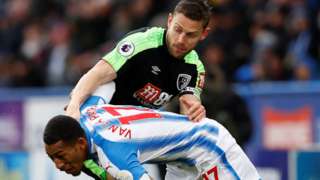 Bournemouth captain Simon Francis in action against Huddersfield