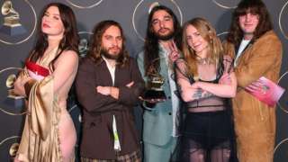 Wet Leg pose with one of their Grammy Awards