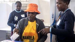 A woman casts her vote at a polling station in Soweto on May 29, 2024 in Johannesburg, South Africa
